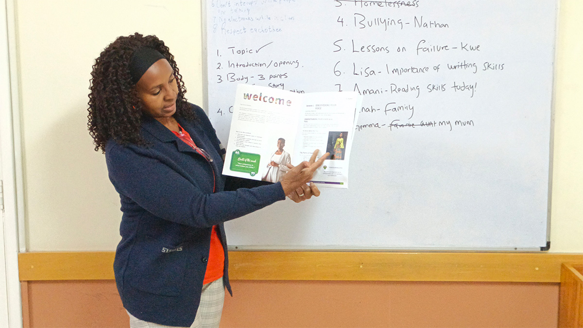 Milcah Wairimu coaching kids public speaking class in Kenya