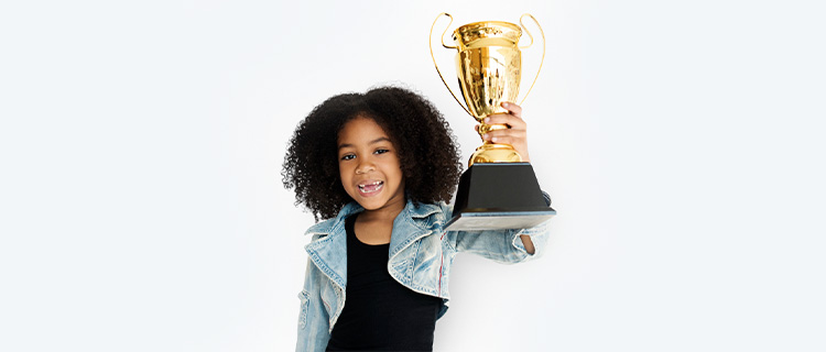 Child presenting on stage at the Sprout Speaking Championship