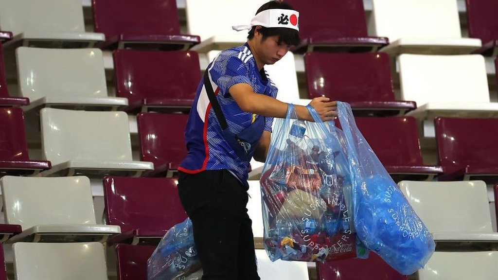 Why Japan Is So Clean. fans cleaning stadium seats after a World Cup match, a lesson in shared responsibility and civic care